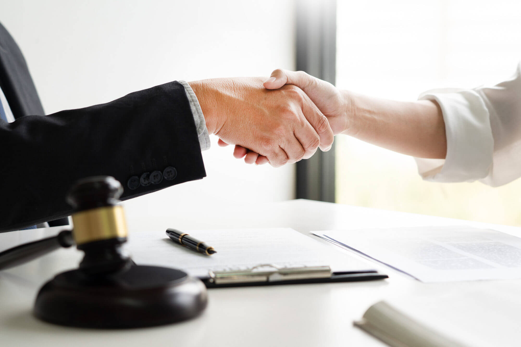 Close up of two business people shaking hands